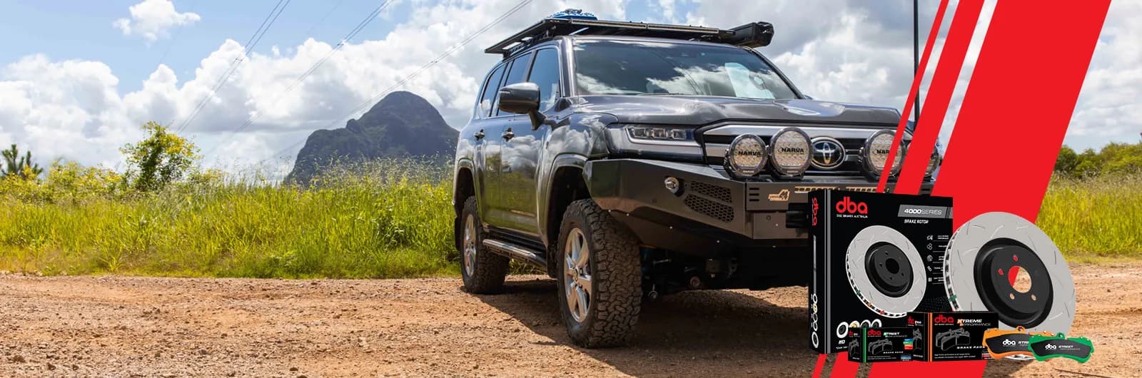 Toyota Land Cruiser on an outback dirt track beside DBA 4000 Series brake rotor and pad packaging