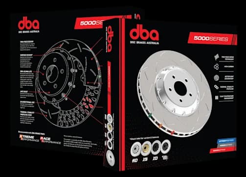 DBA 5000 Series two-piece brake rotor packaging showing product box with technical diagram and actual high-performance rotor with aluminum hat